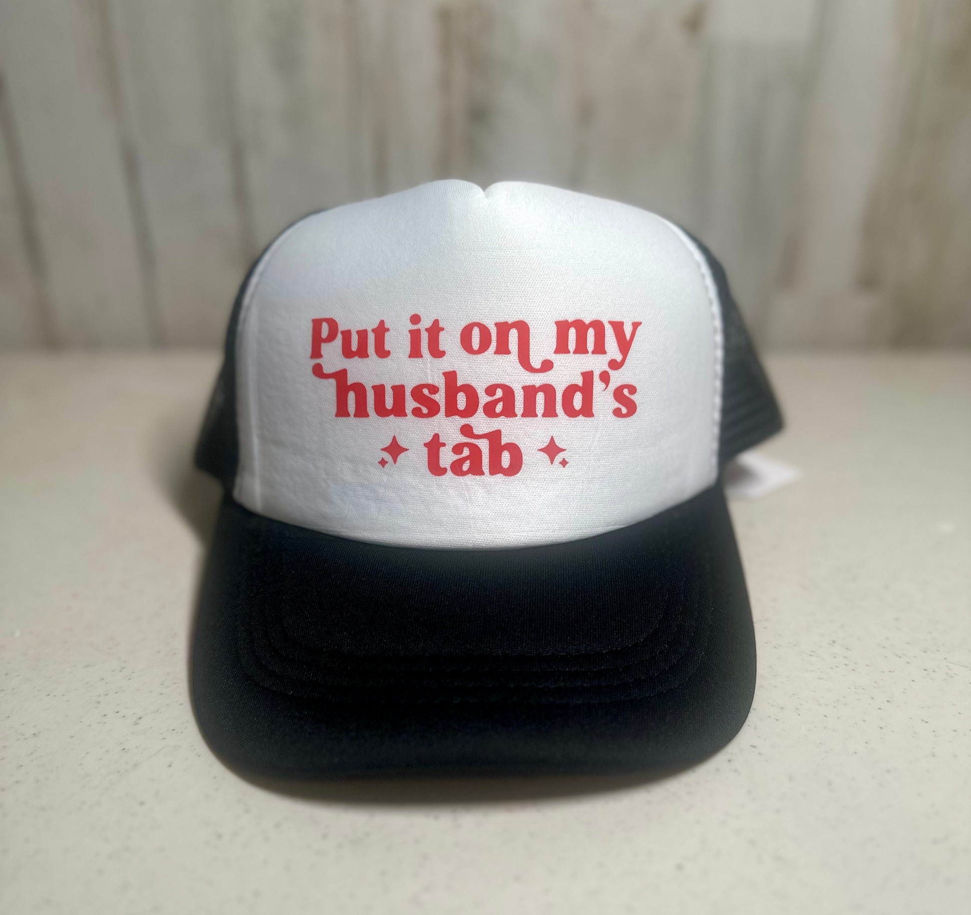 Black/Red Put It On My Husband's Tab Trucker Hat